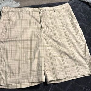 Under Armour tan plaid shorts size 42.